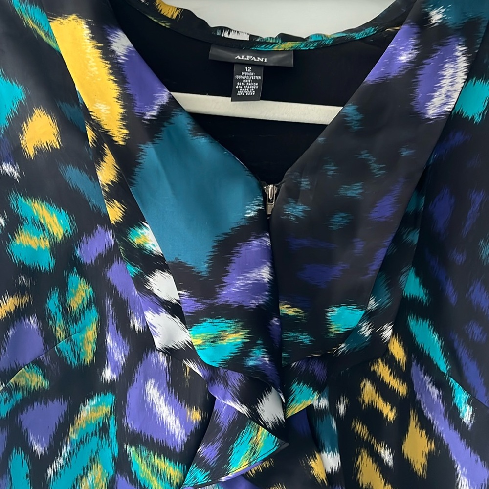 Excellent condition, soft material, back of blouse is all black
